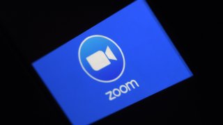 In this March 30, 2020, file photo, a Zoom App logo is displayed on a smartphone in Arlington, Virginia.