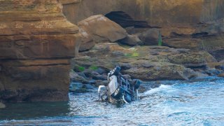 Car over cliff at Sunset Cliffs