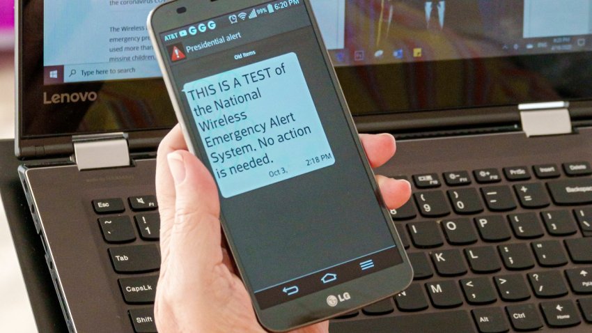 Florida, Miami Beach, National Wireless Emergency Alert System, smartphone and laptop. (Photo by: Jeff Greenberg/Education Images/Universal Images Group via Getty Images)