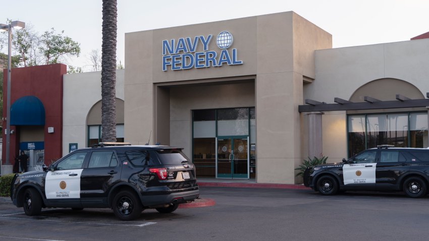 San Diego Police cars parked in front of the Navy Federal Credit Union after a robbery on July 15, 2022.