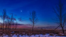 Venus (at left) and Jupiter close together in the dawn sky, and to the east of Scorpius, here at right, with reddish Antares between the trees. This was January 26, 2019. The two planets were closer together earlier in the week but clouds got in the way! Illumination is from the waning gibbous Moon off frame at right. This is a stack of 5 exposures for the ground to smooth noise, and a single untracked exposure for the sky, all 10 seconds at f/4 with the 50mm Sigma lens and Canon 6D MkII at ISO 500. Shot from the back acres of my home site in Alberta on a mild winter morning, with some light cloud drifting through. The sky and ground have been enhanced with Orton-style glow effects applied with Luminar 3. The diffraction spikes were added with Astronomy Tools actions. So, yes, this is a ÒprocessedÓ image, punched up a bit to look pretty. It also provides a good demo example of Rule of Thirds composition. (Photo by: Alan Dyer/VWPics/Universal Images Group via Getty Images)