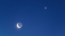 The Waning Crescent Moon with bright Earthshine along with bright Venus in pre-dawn skies. Long exposure.