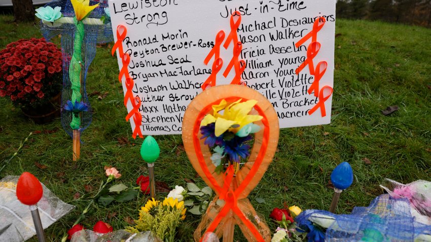 Lewiston, ME – October 30: A makeshift memorial grows outside of Schemengees Bar & Grille, one of two locations where a mass shooting killed 18 people. (Photo by Jessica Rinaldi/The Boston Globe via Getty Images)