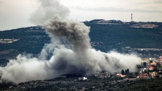 Smoke billows following Israeli bombardment in the village of Shihin in southern Lebanon.