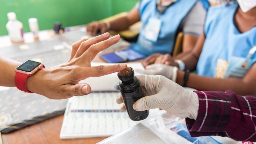 A local prepares to vote at a polling station during General Elections in Santo Domingo, on July 5, 2020 amid the COVID-19 coronavirus pandemic. – Voters in the Dominican Republic are set to defy rising coronavirus infections on Sunday to choose a new president in an election that could end 16 years of unbroken rule by the center-left Dominican Liberation Party. (Photo by STR / AFP) (Photo by STR/afp/AFP via Getty Images)