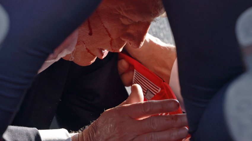 BUTLER, PENNSYLVANIA – JULY 13: Secret Service tend to republican presidential candidate former President Donald Trump onstage at a rally on July 13, 2024 in Butler, Pennsylvania. Butler County district attorney Richard Goldinger said the shooter is dead after injuring former U.S. President Donald Trump, killing one audience member and injuring another in the shooting. (Photo by Anna Moneymaker/Getty Images)
