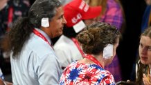 MILWAUKEE, WISCONSIN - JULY 17: People wear "bandages" on their ears on the third day of the Republican National Convention at the Fiserv Forum on July 17, 2024 in Milwaukee, Wisconsin. Delegates, politicians, and the Republican faithful are in Milwaukee for the annual convention, concluding with former President Donald Trump accepting his party's presidential nomination. The RNC takes place from July 15-18. (Photo by Leon Neal/Getty Images)