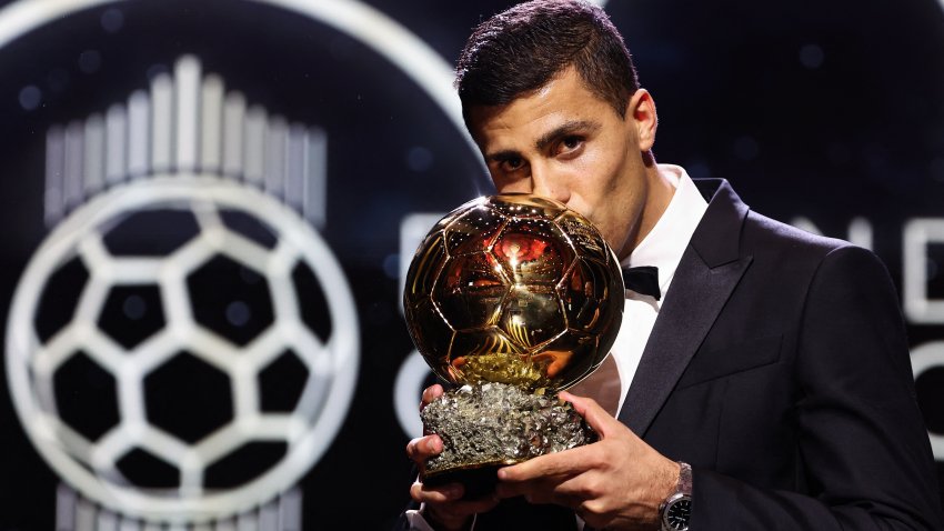 Manchester City’s Spanish midfielder Rodri kisses the trophy as he receives the Ballon d’Or award during the 2024 Ballon d’Or France Football award ceremony at the Theatre du Chatelet in Paris on October 28, 2024. (Photo by FRANCK FIFE / AFP) (Photo by FRANCK FIFE/AFP via Getty Images)