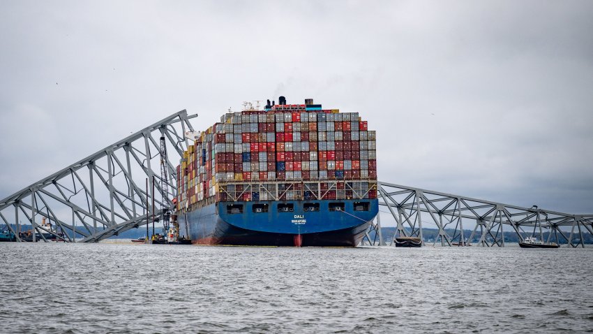 The container ship Dali is seen in the wreckage of Francis Scott Key Bridge almost a week after it hit a structural pier causing a subsequent bridge collapse, April 1, 2024. (Jerry Jackson/The Baltimore Sun/Tribune News Service via Getty Images)