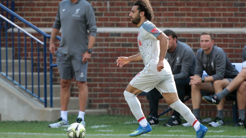 Mohamed Salah (11) of Liverpool brings the ball up the field past the bench during an International Champions Cup match between Manchester United and Liverpool at Michigan Stadium in Ann Arbor, Michigan USA, on Wednesday, July 28,  2018. (Photo by Amy Lemus/NurPhoto via Getty Images)