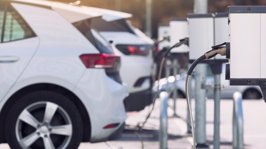 A parking lot with charging stations for electric cars.