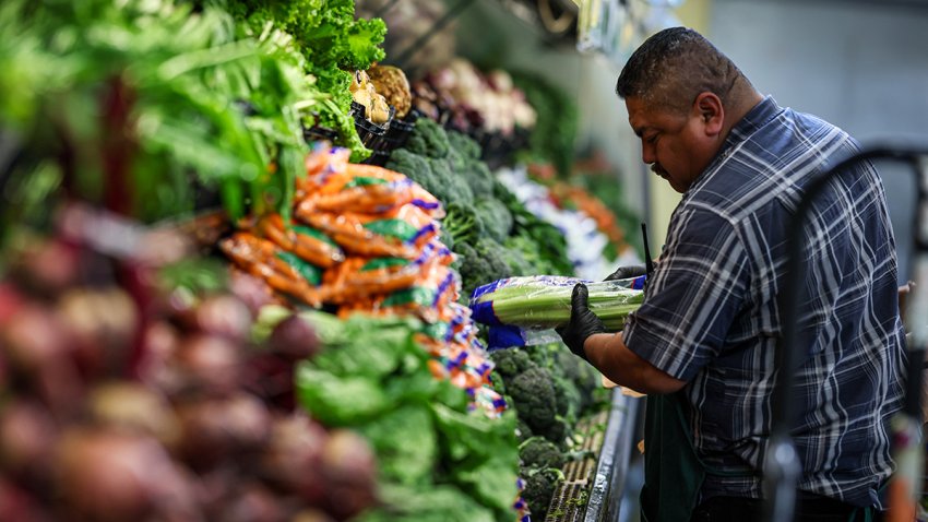Walnut, CA, Monday, April 7, 2025 – Trade tariffs are already affecting grocery stores, like Diamond Farmers Market, where much of their produce and groceries come from foreign countries. Juan Balmaceda fills a shelf with celery from California.  (Robert Gauthier/Los Angeles Times via Getty Images)