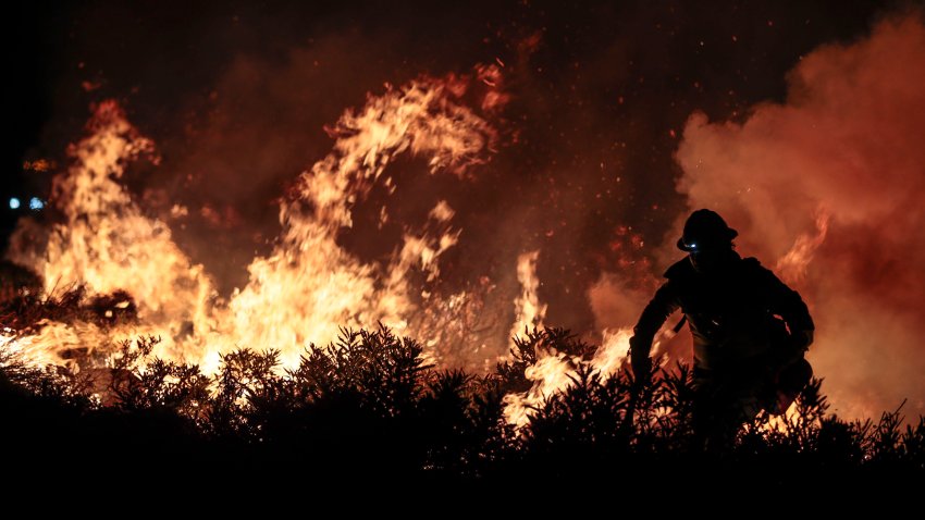 Angeles National Forest, CA, Tuesday, September 22, 2020 – Blue Ridge Hot Shots crew members from Arizona join forces with California firefighters from Northern and Southern California on a backfire operation North of Mt. Wilson on Angeles Crest Highway. Firefighters continue to battle the Bobcat Fire as it continues to burn.   (Robert Gauthier/ Los Angeles Times via Getty Images)