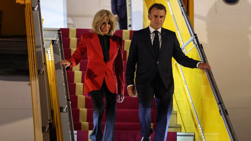TOPSHOT – France’s President Emmanuel Macron and his wife Brigitte Macron disembark from the plane upon their arrival at Noi Bai International Airport in Hanoi on May 25, 2025. French President Emmanuel Macron arrived in Hanoi on May 25, an AFP journalist saw, for the first leg of a Southeast Asia tour that will also see him travel to Indonesia and Singapore. (Photo by Ludovic MARIN / AFP) (Photo by LUDOVIC MARIN/AFP via Getty Images)