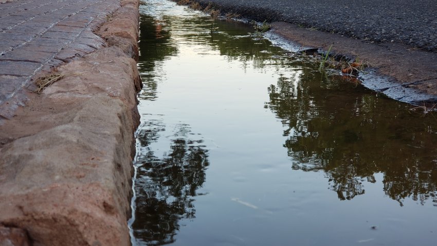 Water used for irrigation in ditch in a rural town along Highway 9 near the entrance to Zion National Park, Utah