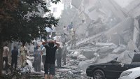 TEHRAN, IRAN – JUNE 13: People look over damage to buildings in Nobonyad Square following Israeli airstrikes on June 13, 2025 in Tehran, Iran. Iran’s three top military generals were killed in the attacks that also targeted nuclear and military facilities, according to published reports. Israel described the strikes as preemptive to keep Iran from obtaining nuclear weapons, the reports said.  (Photo by Majid Saeedi/Getty Images)