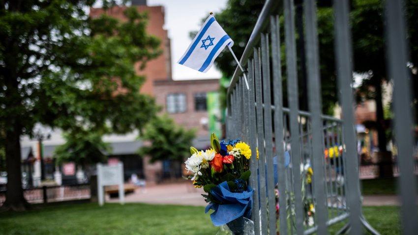 BOULDER, COLORADO – JUNE 2: Flowers and a flag at the site of the attack outside the Boulder County Courthouse on June 2, 2025 in Boulder, Colorado. A suspect is in custody after reportedly throwing incendiary devices at a group participating in an organized walk to show solidarity with hostages held by Hamas in Gaza. The suspect, an Egyptian citizen who had overstayed his visa, has been charged with a hate crime by the F.B.I.  (Photo by Chet Strange/Getty Images)
