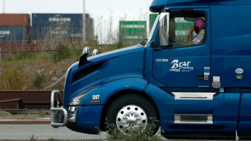 OAKLAND, CALIFORNIA – APRIL 18: A truck driver sits in line as he waits to enter a shipping berth at the Port of Oakland on April 18, 2025 in Oakland, California. The commercial transportation industry is bracing for a sudden drop in work as fallout from U.S. President Donald Trump’s sweeping tariffs continues. American importers are being notified of a surge in canceled sailings by freight ships out of China after the Trump administration announced new fees on Chinese ships. (Photo by Justin Sullivan/Getty Images)